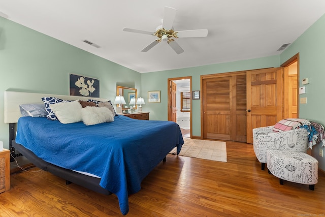 101 Overton Farm Dr, Southbury, CT 06488 - bedroom with wood finished floors, a ceiling fan, and connected bathroom