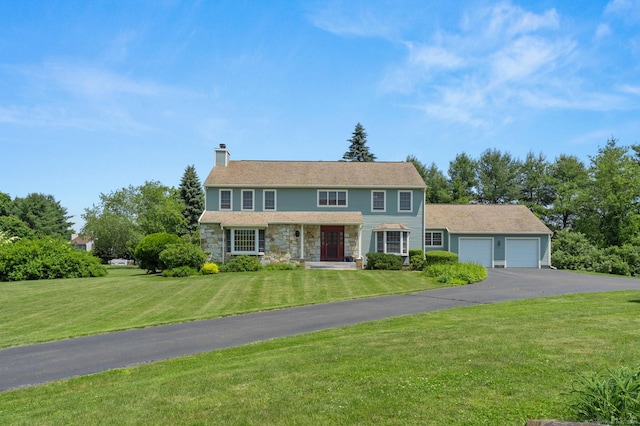 101 Overton Farm Dr, Southbury, CT 06488 - colonial inspired home with a garage, a chimney, driveway, stone siding, and a front lawn
