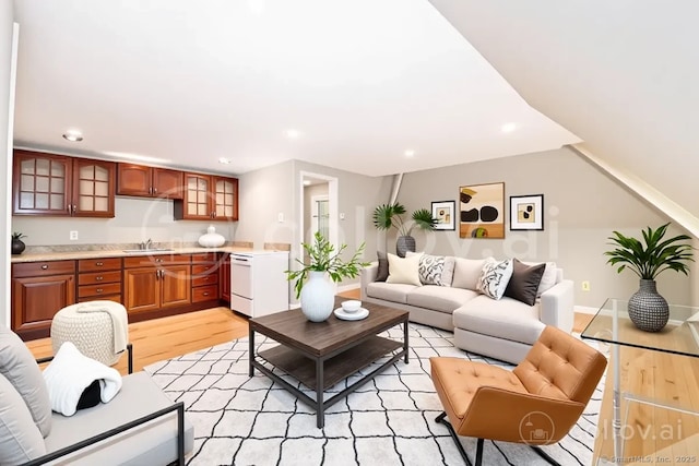 living room featuring light wood finished floors and recessed lighting