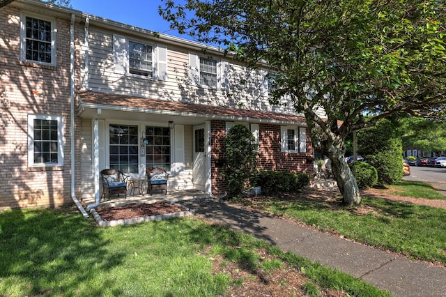 39 Jackson Dr Unit 39, Milford, CT 06460 - view of front facade featuring brick siding and a front yard