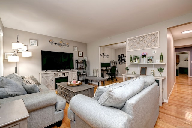 39 Jackson Dr Unit 39, Milford, CT 06460 - living area with light wood-style floors, a desk, and baseboards