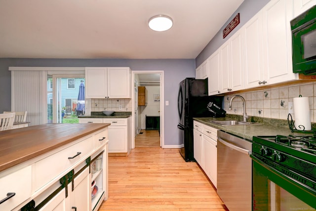 39 Jackson Dr Unit 39, Milford, CT 06460 - kitchen featuring black appliances, a sink, light wood-type flooring, and white cabinets