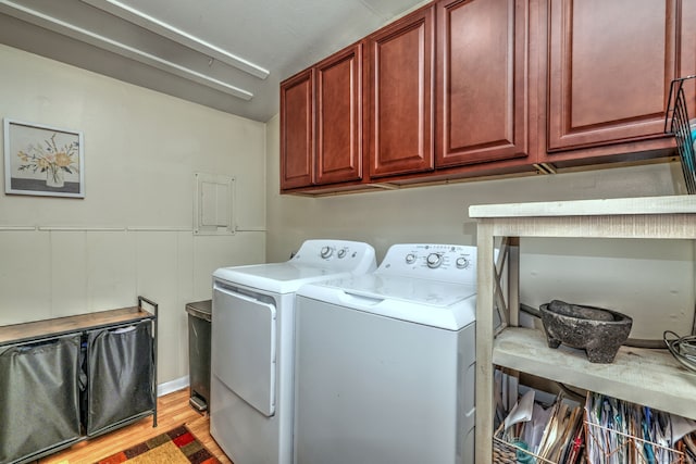 39 Jackson Dr Unit 39, Milford, CT 06460 - laundry room featuring cabinet space, washing machine and clothes dryer, and light wood-type flooring