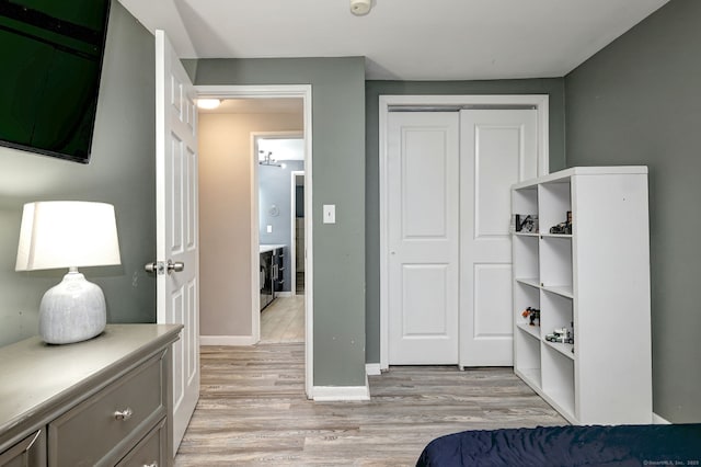 39 Jackson Dr Unit 39, Milford, CT 06460 - bedroom with light wood-style floors, a closet, and baseboards