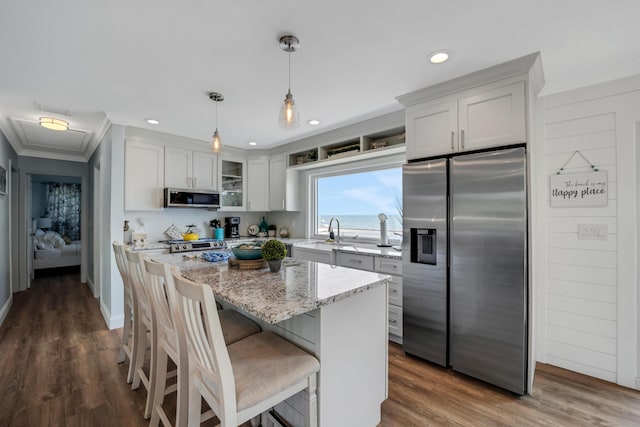 74 Morgan Ave, East Haven, CT 06512 - kitchen with appliances with stainless steel finishes, a sink, glass insert cabinets, light stone countertops, and recessed lighting