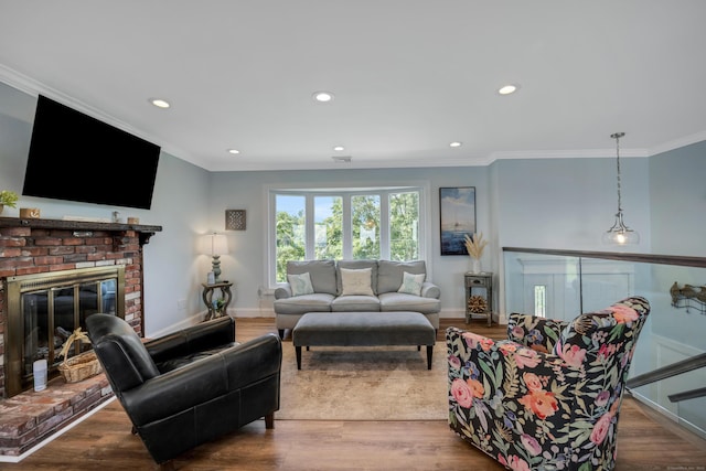 74 Morgan Ave, East Haven, CT 06512 - living room featuring crown molding, recessed lighting, baseboards, a fireplace, and wood finished floors