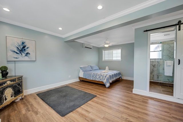74 Morgan Ave, East Haven, CT 06512 - bedroom with a wall mounted air conditioner, ornamental molding, a barn door, baseboards, and wood finished floors