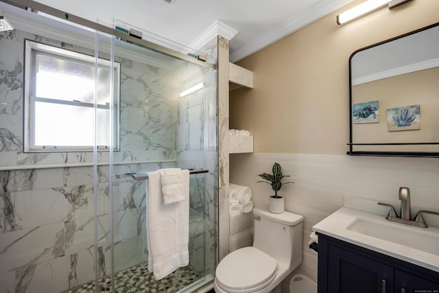 74 Morgan Ave, East Haven, CT 06512 - bathroom featuring vanity, toilet, crown molding, a marble finish shower, and tile walls