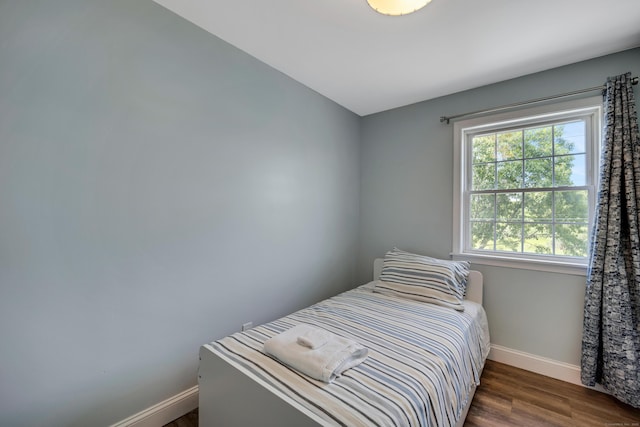 74 Morgan Ave, East Haven, CT 06512 - bedroom with baseboards and dark wood-style flooring