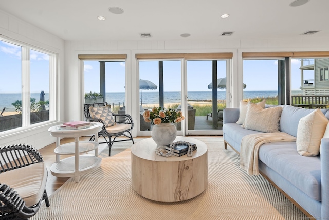 685 Fairfield Beach Rd Unit 685, Fairfield, CT 06824 - sunroom with a water view, recessed lighting, and wood finished floors
