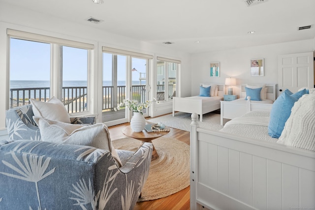 685 Fairfield Beach Rd Unit 685, Fairfield, CT 06824 - living room with wood finished floors, a water view, healthy amount of natural light, and recessed lighting