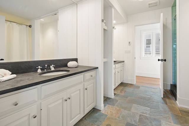 685 Fairfield Beach Rd Unit 685, Fairfield, CT 06824 - full bathroom with vanity, stone finish floors, and baseboards
