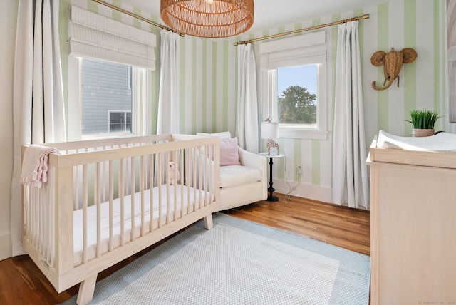685 Fairfield Beach Rd Unit 685, Fairfield, CT 06824 - bedroom featuring wood finished floors, wallpapered walls, and baseboards
