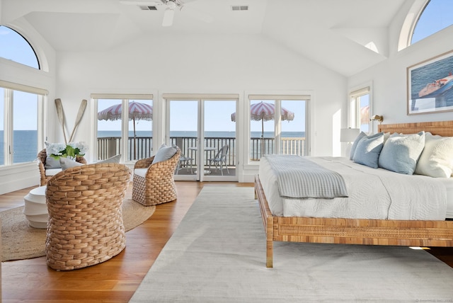 685 Fairfield Beach Rd Unit 685, Fairfield, CT 06824 - bedroom featuring access to outside, wood finished floors, vaulted ceiling, a water view, and ceiling fan