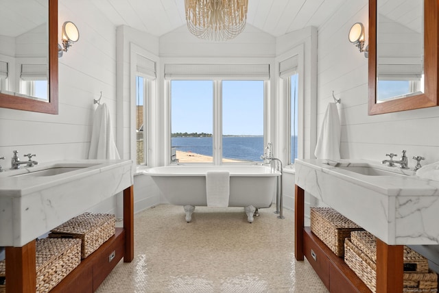 685 Fairfield Beach Rd Unit 685, Fairfield, CT 06824 - full bath featuring a water view, a freestanding bath, lofted ceiling, a chandelier, and a sink
