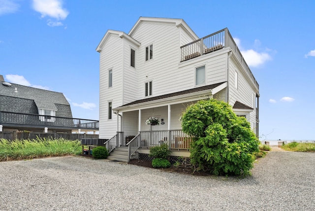685 Fairfield Beach Rd Unit 685, Fairfield, CT 06824 - view of front of house featuring covered porch and a balcony