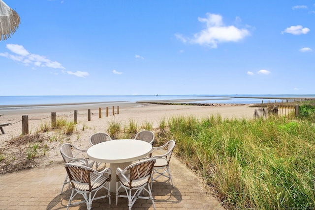 685 Fairfield Beach Rd Unit 685, Fairfield, CT 06824 - view of patio / terrace featuring view of water and beach and outdoor dining space