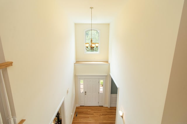 1705 Orchard Rd, Berlin, CT 06037 - foyer entrance with a chandelier, light wood-style floors, healthy amount of natural light, and a high ceiling