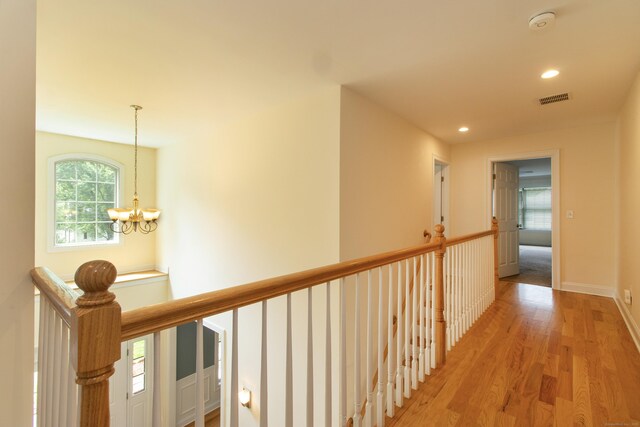 1705 Orchard Rd, Berlin, CT 06037 - hall with light wood-style flooring, an upstairs landing, a chandelier, and recessed lighting
