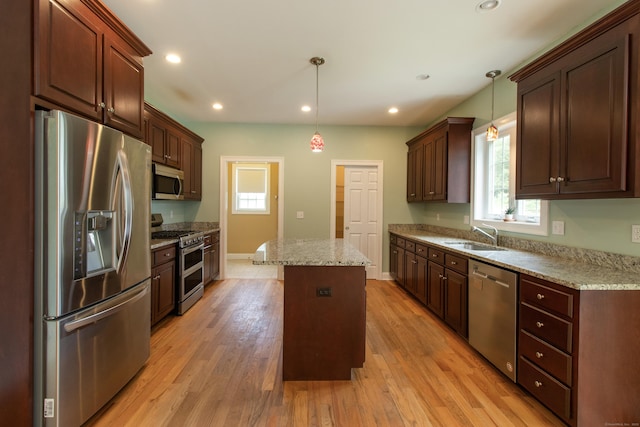 1705 Orchard Rd, Berlin, CT 06037 - kitchen with appliances with stainless steel finishes, healthy amount of natural light, a kitchen island, light wood finished floors, and recessed lighting