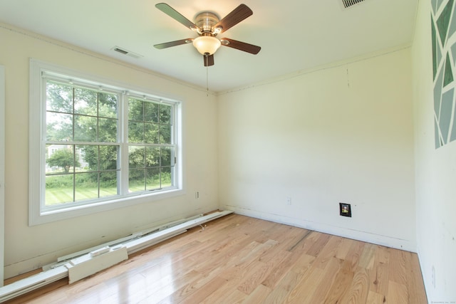 1705 Orchard Rd, Berlin, CT 06037 - empty room with light wood-style floors, ceiling fan, and a baseboard heating unit