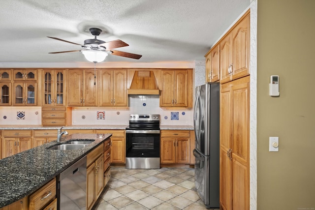 9 Philip Ln, Ledyard, CT 06339 - kitchen featuring stainless steel appliances, custom range hood, decorative backsplash, glass insert cabinets, and ceiling fan