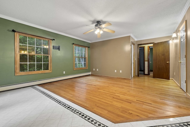 9 Philip Ln, Ledyard, CT 06339 - empty room featuring ceiling fan, healthy amount of natural light, light wood-type flooring, a baseboard heating unit, and crown molding