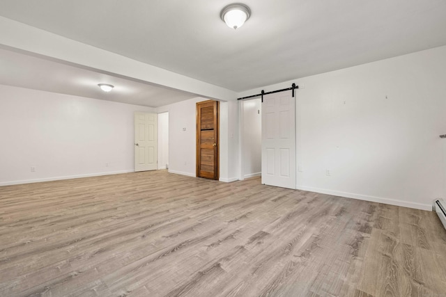 9 Philip Ln, Ledyard, CT 06339 - below grade area with light wood-style flooring and baseboards