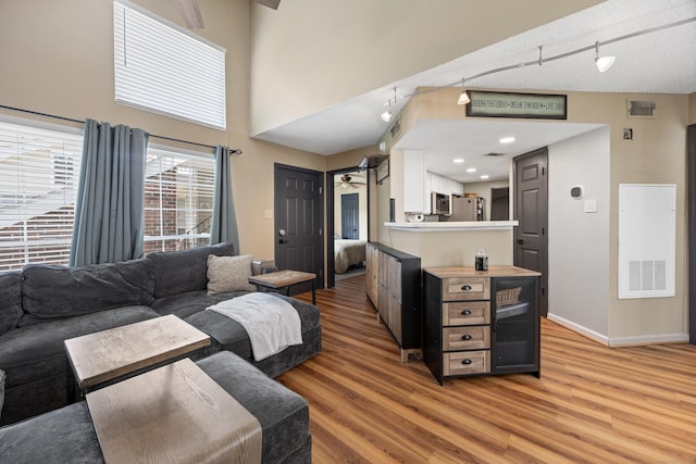 136 Carriage Crossing Ln Unit 136, Middletown, CT 06457 - living area featuring light wood finished floors and a heating unit