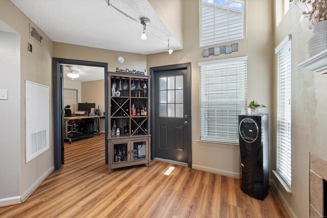 136 Carriage Crossing Ln Unit 136, Middletown, CT 06457 - foyer with wood finished floors and a textured ceiling
