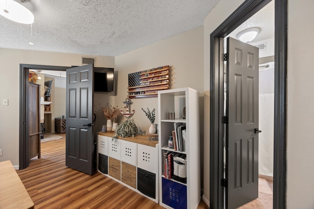 136 Carriage Crossing Ln Unit 136, Middletown, CT 06457 - hall with wood finished floors and a textured ceiling