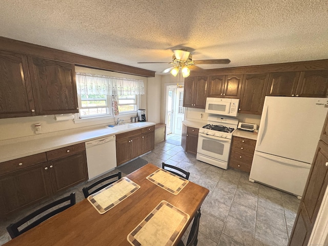 155 Harding St, New Britain, CT 06052 - kitchen with white appliances, ceiling fan, dark brown cabinets, a textured ceiling, and light countertops