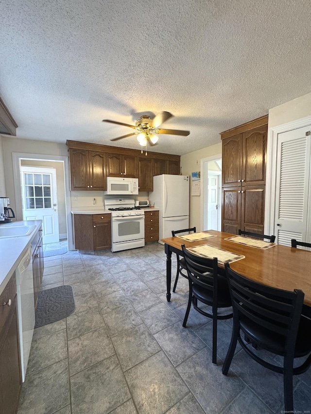 155 Harding St, New Britain, CT 06052 - kitchen with white appliances, light countertops, a ceiling fan, and a textured ceiling