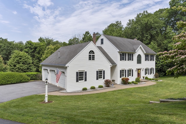 109 Andrew Dr, Canton, CT 06019 - colonial-style house with a chimney, asphalt driveway, a front lawn, a shingled roof, and a garage