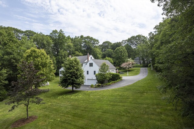 109 Andrew Dr, Canton, CT 06019 - view of green lawn featuring driveway and an attached garage
