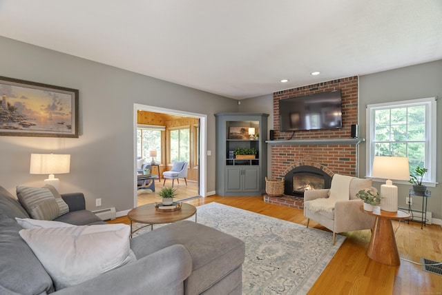 109 Andrew Dr, Canton, CT 06019 - living area featuring plenty of natural light, light wood-style flooring, baseboard heating, and recessed lighting