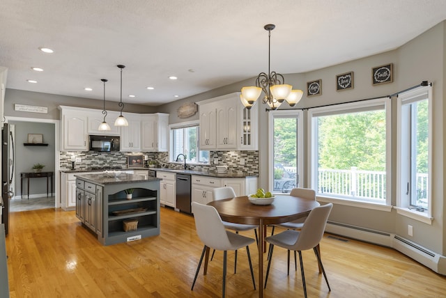 109 Andrew Dr, Canton, CT 06019 - dining space featuring light wood-style floors, baseboard heating, a chandelier, and recessed lighting