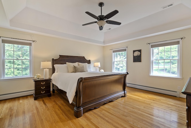 109 Andrew Dr, Canton, CT 06019 - bedroom with a baseboard heating unit, a raised ceiling, and light wood finished floors