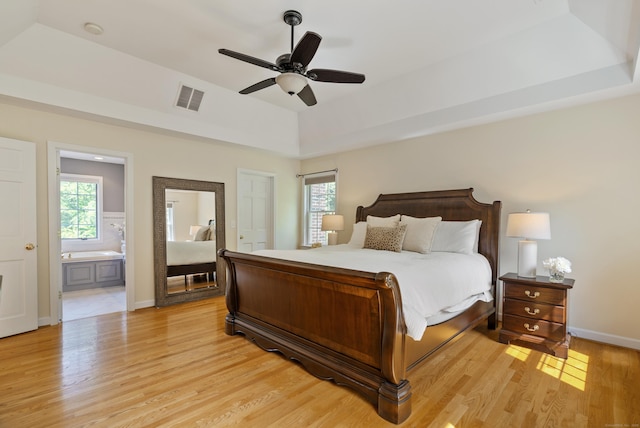 109 Andrew Dr, Canton, CT 06019 - bedroom featuring light wood finished floors, multiple windows, connected bathroom, and a ceiling fan
