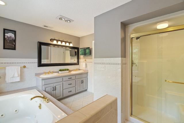 109 Andrew Dr, Canton, CT 06019 - bathroom with tile walls, double vanity, a shower stall, a tub with jets, and tile patterned flooring