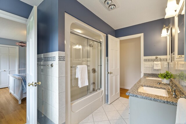109 Andrew Dr, Canton, CT 06019 - full bath with double vanity, enclosed tub / shower combo, and tile patterned flooring