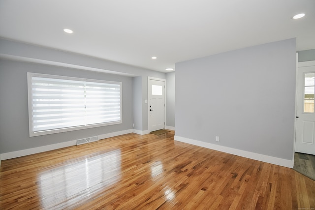 10 Yale Dr, Enfield, CT 06082 - empty room with light wood finished floors, baseboards, and recessed lighting