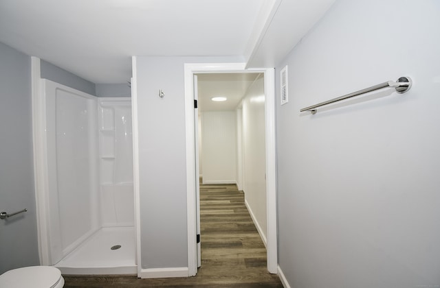 10 Yale Dr, Enfield, CT 06082 - bathroom with wood finished floors, a shower stall, baseboards, and toilet