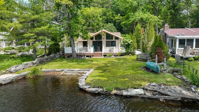 27 E Shore Dr, Haddam, CT 06441 - rear view of property featuring a sunroom, a deck with water view, and a yard