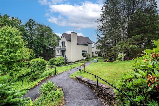 192 Heritage Vlg Unit A, Southbury, CT 06488 - view of property exterior with a chimney and stairs
