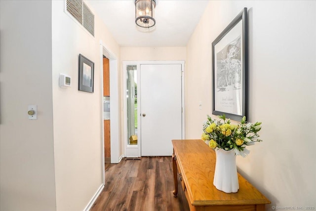 192 Heritage Vlg Unit A, Southbury, CT 06488 - doorway to outside with dark wood-style floors and baseboards