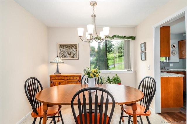 192 Heritage Vlg Unit A, Southbury, CT 06488 - dining room featuring a chandelier and baseboards