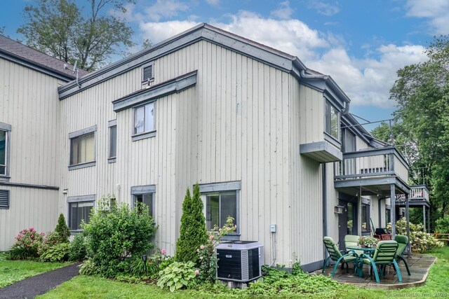 192 Heritage Vlg Unit A, Southbury, CT 06488 - view of home's exterior with a central AC unit