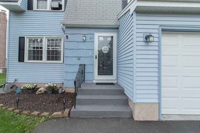 47 Pebble Dr, Newington, CT 06111 - entrance to property with roof with shingles and an attached garage