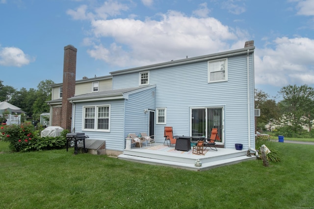 47 Pebble Dr, Newington, CT 06111 - rear view of house with a lawn, a chimney, and a deck